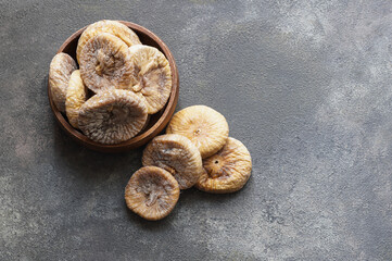 Sun dried figs on rustic table, organic tasty fruits, healthy dry fruit concept