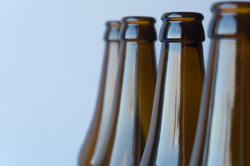 Close-up of empty brown glass bottles: The transparent brown glass highlights their utilitarian...