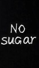 Fototapeta premium Written text NO SUGAR on black background isolated with white highlights, png