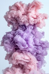 Fototapeta premium Abstract pink and purple ink swirling in water, creating a vibrant and colorful cloud of smoke.