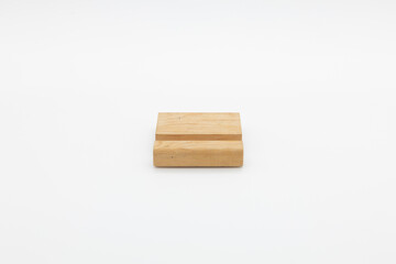 Minimalist wooden phone holder with a simple groove design