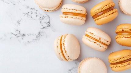 Fototapeta premium White and orange macarons on marble background, dessert flat lay with copy space, minimal food photography, gourmet baked goods, pastel sweet treats arrangement
