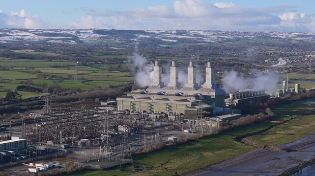 Aerial view of large power station and substation in the United Kingdom. Electricity grid concept
