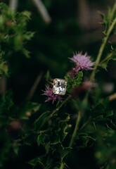 Bezel engagement ring in purple flowers