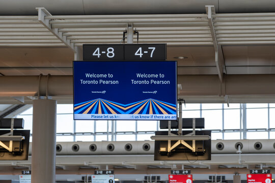 Sign on screen welcome to Toronto Pearson with the logo at the Toronto International Airport.
