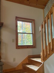 interior of a house with a window and fall foliage 