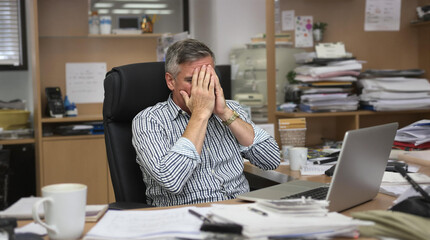 Obraz premium An Overwhelmed Office Worker Stressed Out by Excessive Paperwork and Intense Deadline Pressure