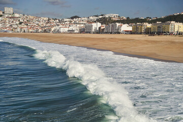 A closeup shot of the ocean with wind waves crashing onto the shore, creating a beautiful pattern...