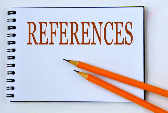 REFERENCES - word in notebook on white background with pencils