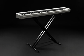 Synthesizer on black background. Electronic musical instrument