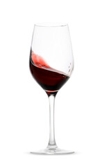 Red wine splashing in glass on white background