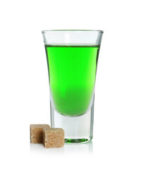 Absinthe in shot glass and brown sugar isolated on white