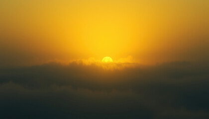 Obraz premium Soft sunlight and dense fog merging over forested hills and clouds with warm yellow and green hues, evoking a dreamlike natural atmosphere