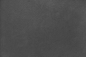 Natural, genuine solid gray leather texture close up, macro. Structure of matte leatherette, artifical skin surface with embossing pattern. Background, wallpaper, backdrop