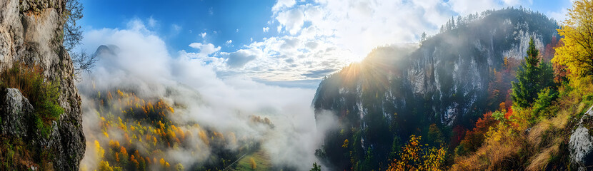 Fototapeta premium Panoramic view of the mountain peaks at sunrise