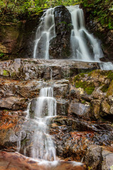 Fototapeta premium A waterfall with a lot of water coming out of it