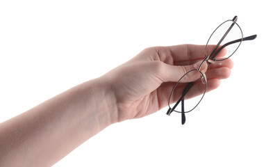 Woman holding glasses with round metal frame on white background, closeup
