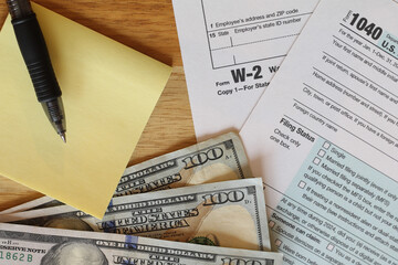 IRS 1040 and W-2 tax forms, close up, top down view 