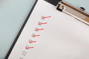Checklist boxes close up with red ticks, check marks