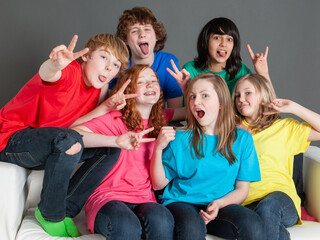 Early Teens: Candid Portrait. Portrait of a relaxed group of early teenage friends messing about...