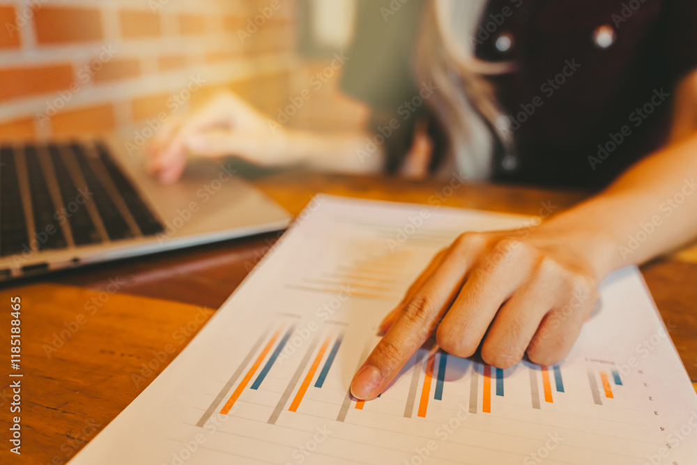 Poster business analysis with graphs and laptop in modern workspace setting