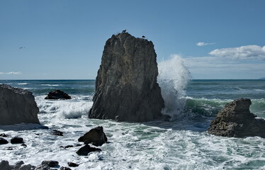 Russia, Sudak. The Republic of Crimea. View of the rocky coast of the Black Sea with waves hitting...