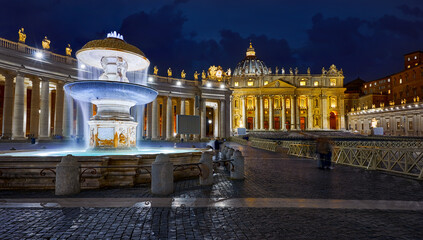 Vatican City (Holy See. St. Peter's Basil Cathedral on Saint Peter Square. Nighttime with ancient fountain.
