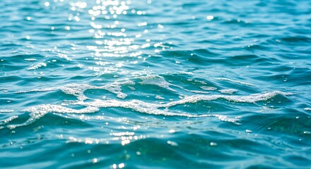 Pure blue turquoise water texture of the ocean sea with foam from and waves
