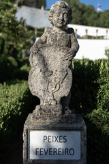Fototapeta premium Stone statue depicting the sign fish belonging to the episcopal garden of the city of Castelo Branco
