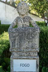Fototapeta premium Stone statue depicting the sign fire belonging to the episcopal garden of the city of Castelo Branco-Portugal