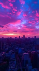 Fototapeta premium Stunning urban sunset with vibrant pink and purple skies over the city skyline.