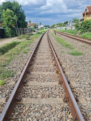 Fototapeta premium railroad tracks in the forest urban viilage
