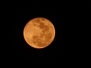Amber Moon: A Nighttime Celestial Orb in Warm Hues