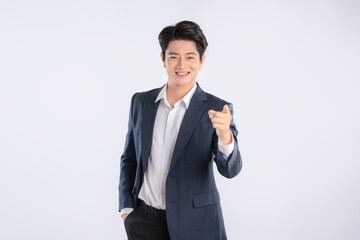 Portrait of young Asian business man posing on white background