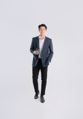 Full body image of a young Asian business man posing on a white backgrounded Image