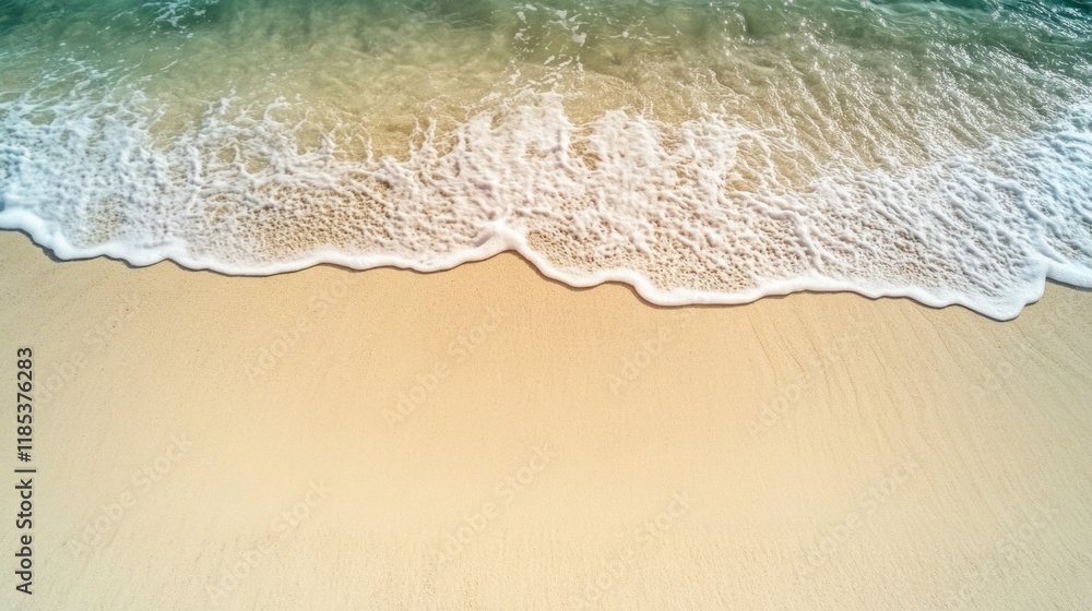 Poster Aerial view of sandy beach with gentle waves lapping at shore, creating serene atmosphere