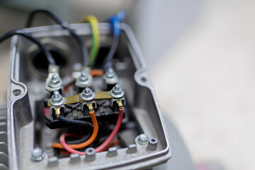 electrical cables connecting with terminal of motor in cover box of Power induction motor pump.Motor Terminal Box ..