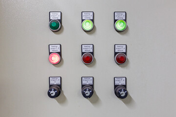Electrical control panel and light switches that indicate operating status in the control room