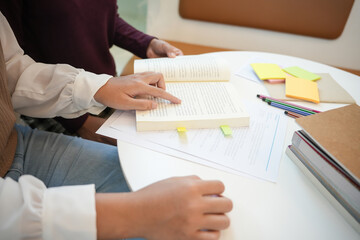 Learning with friends Young students campus.High School Tutor for examining helps school homework together with&nbsp;friend catching up and learning