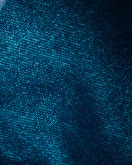 Texture of dark turquoise velvet fabric close up
