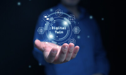Digital twin concept.  Industrial manufacturing automation technology. A man with digital twin icons in his hand.