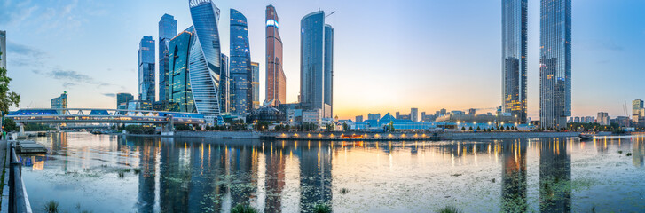 Fototapeta premium High buildings of Moscow-City at Moskva River at summer sunset, Russia.