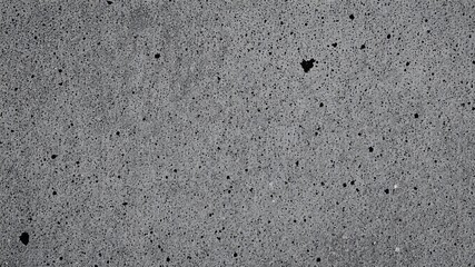 Grainy powder coating surface texture in black and white hues, abstract, backdrop