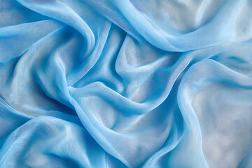 Obraz premium Delicate blue translucent fabric waves forming layered textures with a soft and airy abstract flow, ideal for design backgrounds and text overlays