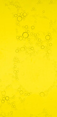 Macro microscope yellow bubble texture, Close-up Yellow bubbles and drops oil background . golden Yellow water bubbles, close up golden oil drop for celebration