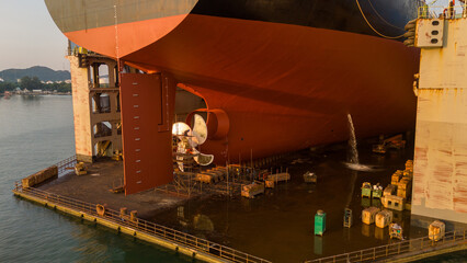 Propeller of large ship spinning power working and water splash contrail . Close up image detail...