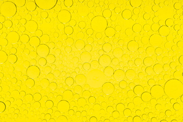 Macro microscope yellow bubble texture, Close-up Yellow bubbles and drops oil background . golden Yellow water bubbles, close up golden oil drop for celebration