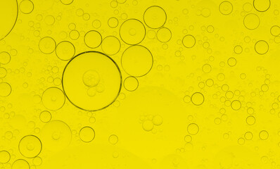 Macro microscope yellow bubble texture, Close-up Yellow bubbles and drops oil background . golden...