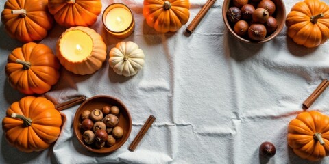 Autumnal Harvest Gathering Pumpkins, Candles, Nuts, and Spices on Linen Cloth