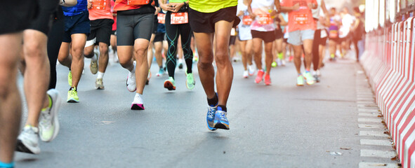 Marathon Running In The Light Of Morning, People Running On City Road Detail On Legs, Step, Walk And Outdoor Exercise Activities Concept.